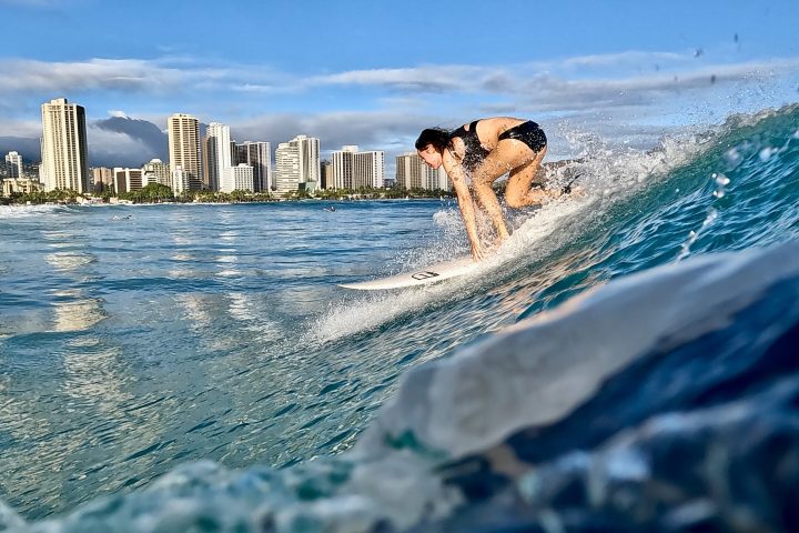 a person riding a wave on a surfboard in the water